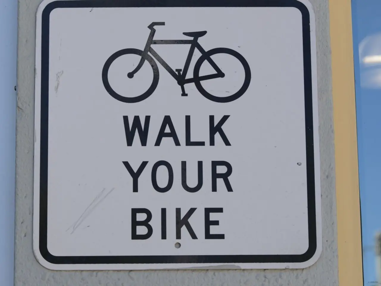 In this image there is a sign board with an image and text on it.