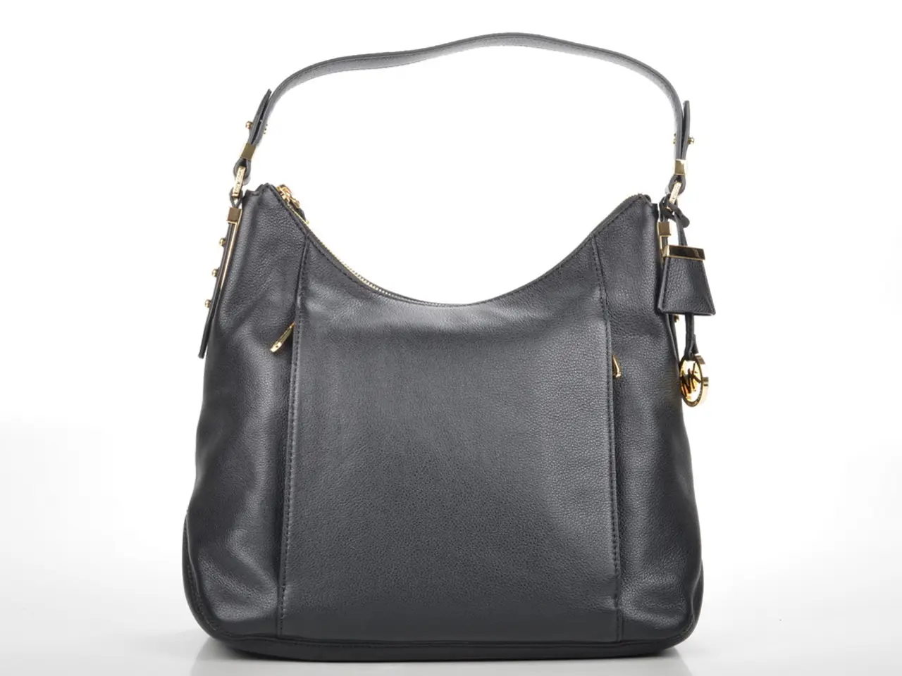 In this picture we can see a black color bag with belt and some chain to it.