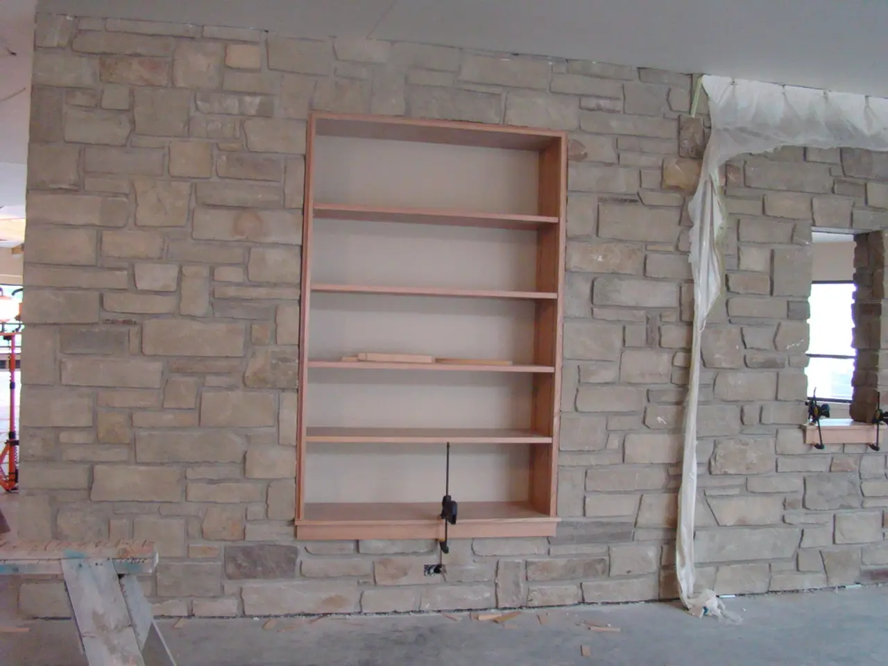 Here we can see a rack and a wall.