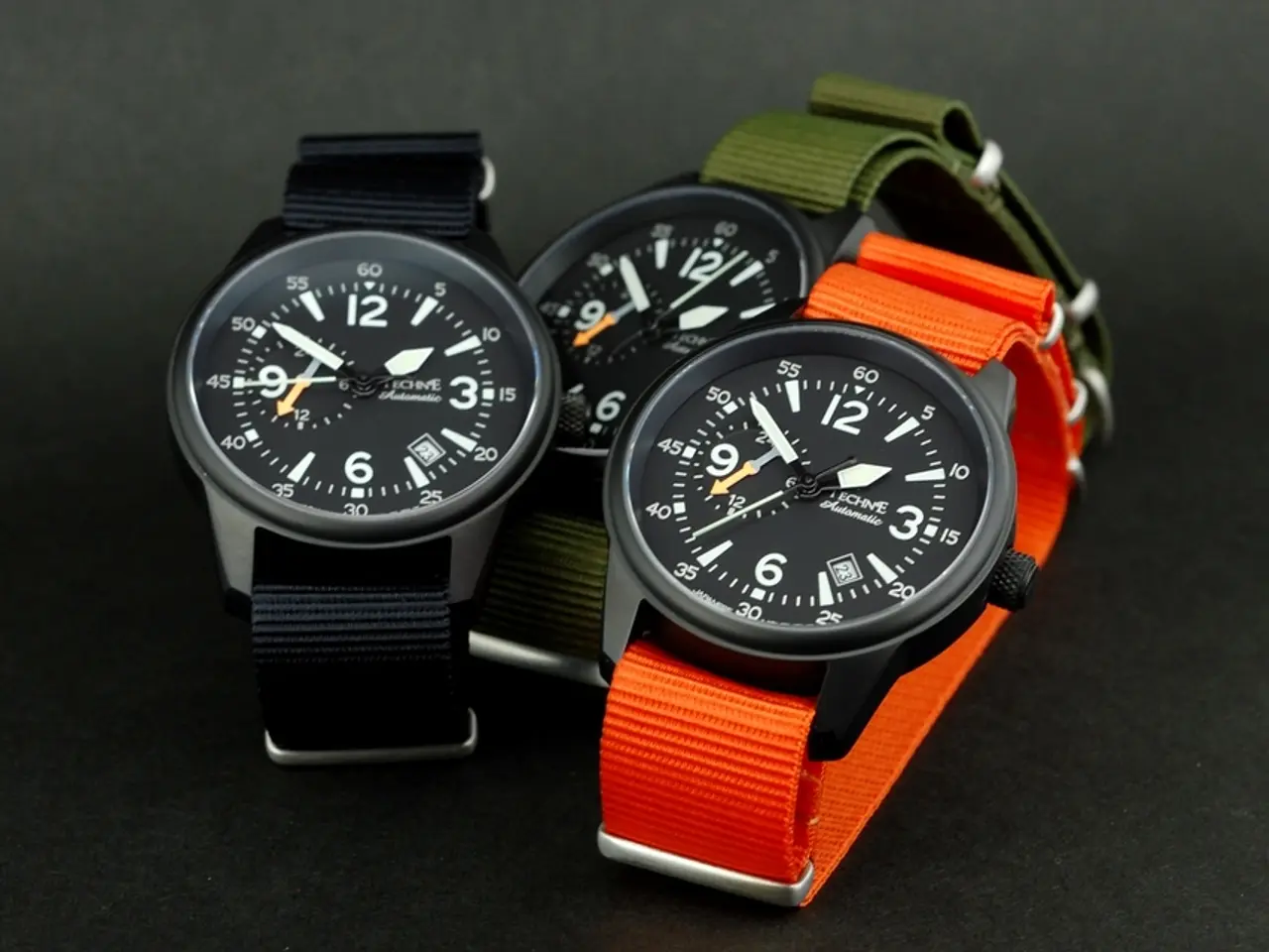 In this picture there are three different colors of watches and there are numbers and hours,...