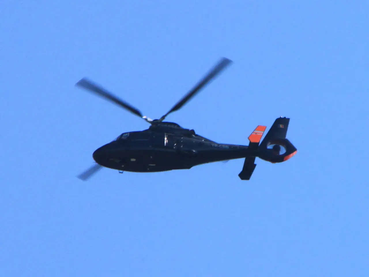 In this image we can see a helicopter is flying in the sky.