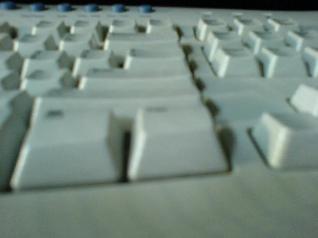 This is a keyboard which is white in color and also has some buttons which are white in color and...