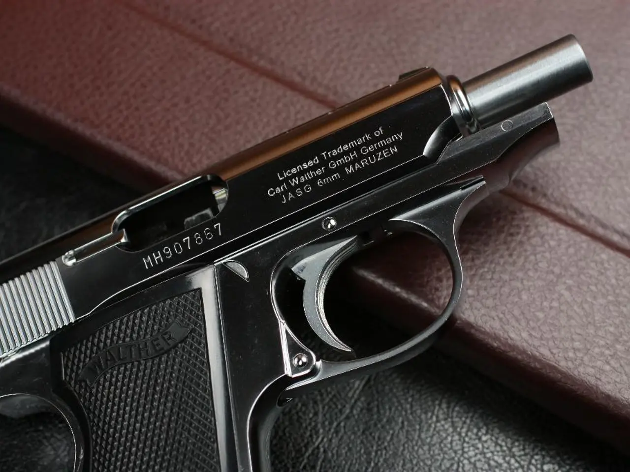 In this picture I can see the pistol.