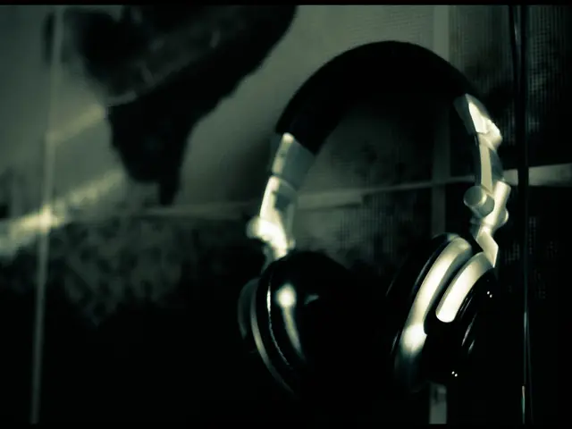 In this image we can see the headsets. The background of the image is dark.