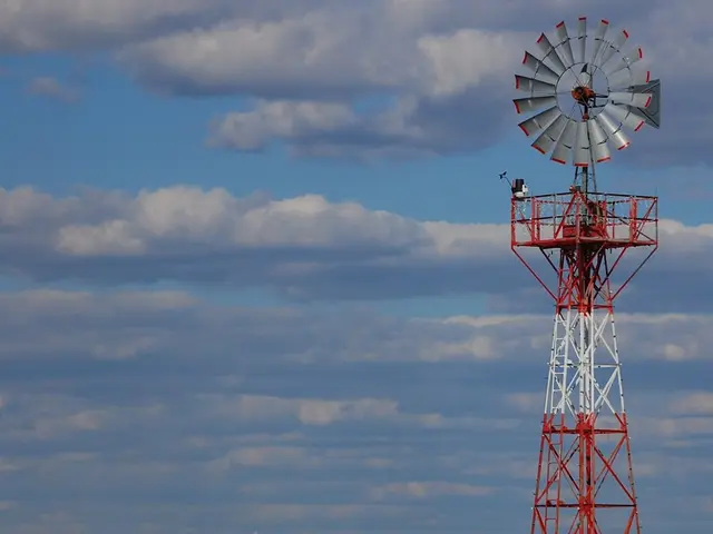In this picture we can see a clear blue sky with clouds, trees and smoke. This is a Transmission...