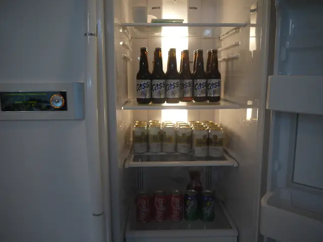 In this picture we can see bottles in the refrigerator.