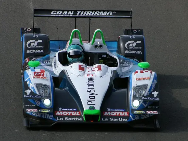 In the image in the center, we can see one sports car and we can see something written on it.