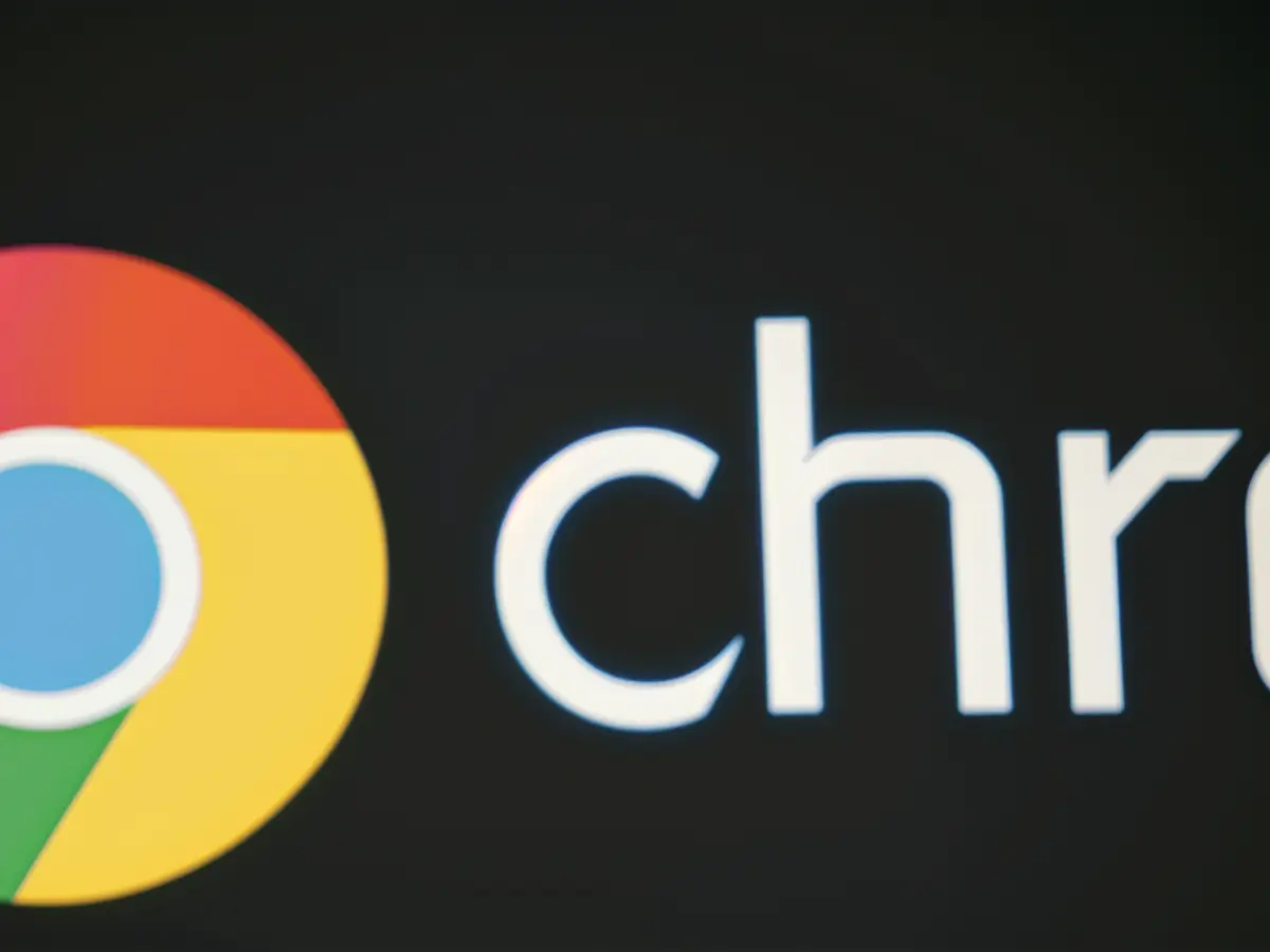 Chrome emblem displayed against a dark backdrop