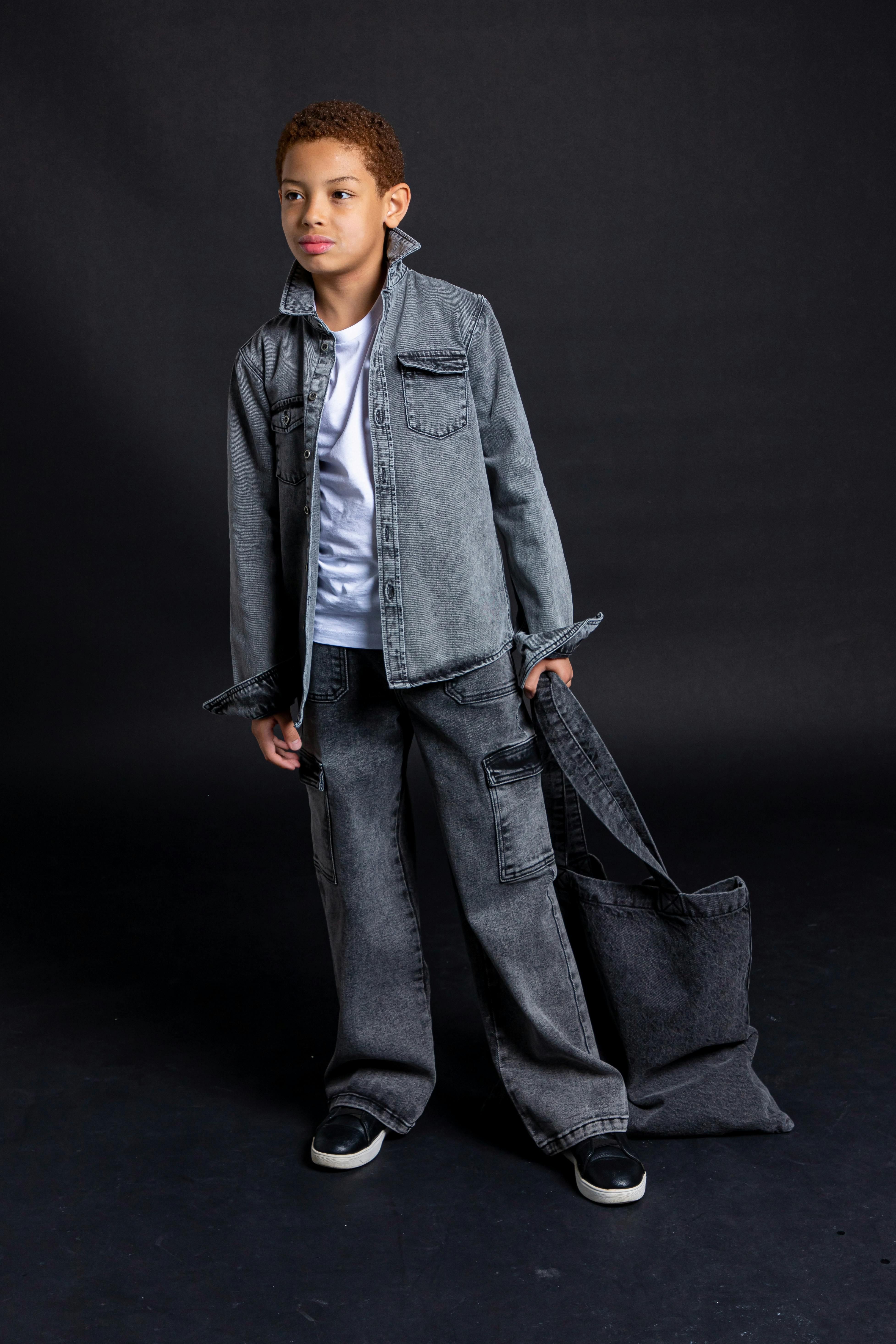 Description of the image: Police investigating a crime scene, with several people discussing in the background, advocating for radical political change. A sign with a controversial slogan can be seen in the foreground. Elon Musk's fictional